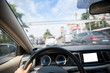 © lzf - Driving car on city street waiting infront of the traffic lights