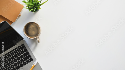Fotografía Top view image of white working desk with accessories putting on it