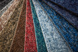 © Khaligo - Close up huge arrenge of colorful carpets, floor sampler, swatch, design