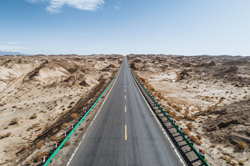 Wall Mural - aerial view of desert road in northwest of China