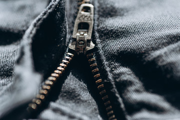 locking zipper on jeans, close up. grey color