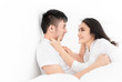 © jokekung - asian lover rest on bed, they use hand touch on face together, they feeling love and happy together, happiness honeymoon and valentine's day