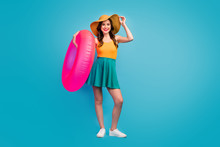 Full Length Photo Of Pretty Funny Lady Traveler Good Mood Exotic Resort Hold Big Pink Lifebuoy Swimming Ocean Sea Time Wear Mini Summer Dress Hat Shoes Isolated Blue Background
