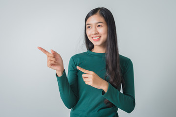 Beautiful young asian woman smiling and looking happily.