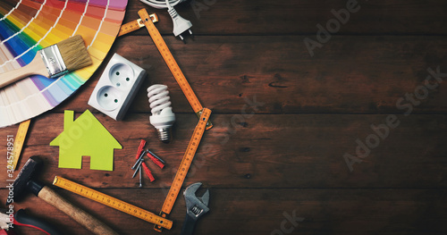 Fotomural home improvement and repair concept - construction tools and objects on wooden background