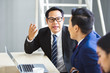 © eakgrungenerd - asian businessman talking problem agreement workplace in office.