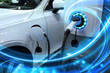 canvas print picture - EV Car or Electric vehicle at charging station with the power cable supply plugged in on blurred nature with blue energy power effect. Eco-friendly sustainable energy concept.