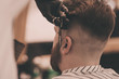 © jozzeppe777 - Brutal bearded man getting beard haircut by hairdresser at barbershop