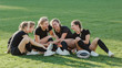 Sportive women talking to each other on grass