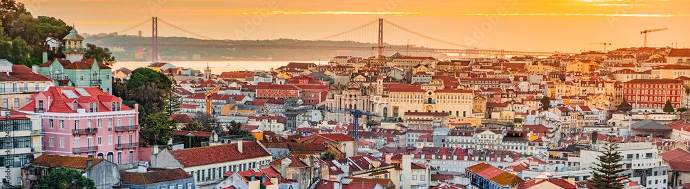 A view of the Alfama downtown and the 25 April Bridge. - obrazy, fototapety, plakaty 