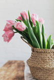Fototapeta Tulipany - pink tulips at home on a wooden table
