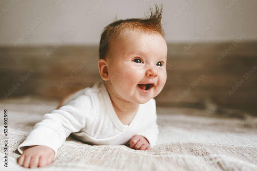 Smiling baby infant crawling at home adorable child portrait family lifestyle 3 month old kid - obrazy, fototapety, plakaty 