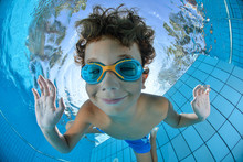 Happy Young Boy Swim And Dive Underwater,fun In Pool