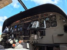 Close-Up Of Cessna 208B Grand Caravan Navigation Plane Dashboard And Cockpit Instruments. Detailed View On Engine Power Control.