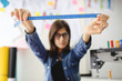 © Visual Intermezzo - Young fashion designer keep ahead measure tape.