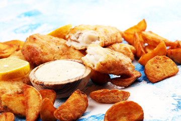 Wall Mural - traditional British fish and chips consisting of fried fish, potato chips and mayonnaise