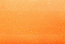 Water Drops On Orange Background