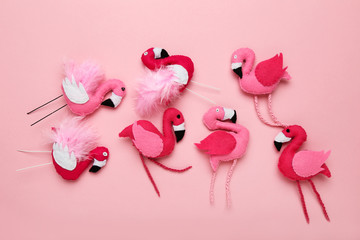 Sticker - Soft toy of flamingos on pink background