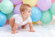 © Oksana - Сute baby boy on the background of balloons