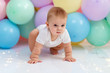 © Oksana - Сute baby boy on the background of balloons