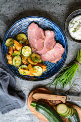 Canvas Print - Smoked pork neck with crispy roasted potatoes and zucchini slices