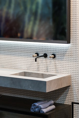 Bathroom interior grey marble sink and black tap. Beautiful modern bathroom design