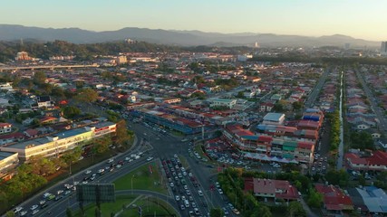 Wall Mural - Aerial 4K footage of beautiful sunset over Kota Kinabalu Cityscape in Kota Kinabalu, Sabah, Malaysia