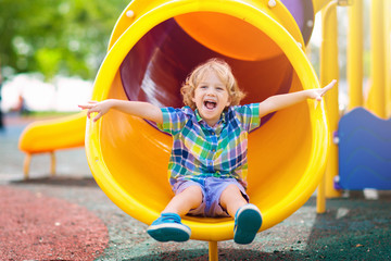 child on playground. kids play outdoor.