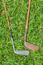 Two Vintage Golf Clubs With Hickory Shafts Isolated Outdoors Image With Copy Space
