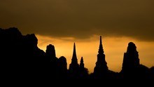 The Scenery Of Wat Mahathat Temple In Silhouette Look In Ayutthaya, Thailand.