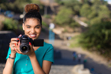 African American woman  photographer taking outdoor photos -  Black people