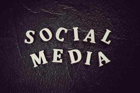 Social media text written on black background