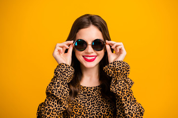 Wall Mural - Close-up portrait of her she nice-looking attractive lovely fashionable glamorous cheerful cheery wavy-haired girl touching specs isolated on bright vivid shine vibrant yellow color background