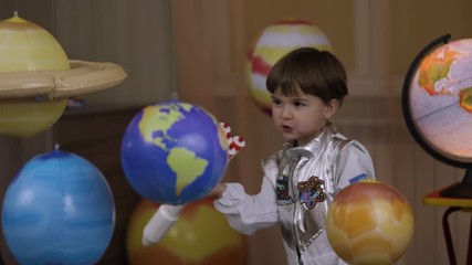 Wall Mural - Space Travel Game Inspiration Spaceship. Little Kid Boy Astronaut Launching Toy Rocket From Spaceport Through Planets. Child Dreamer Playing With Toy Space Rocket Flying Among Planets. SLOW MOTION.