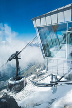 The cableway is arriving to Punta Helbronner station immersed in the clouds
