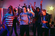 © AnnaStills - Multiethnic group of young people dancing together and having fun at disco party