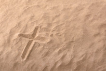 Cross As Religious Symbol Engraved In The Sand