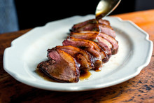 Tilt Shift View Of Plated Slices Of Seared Duck Breast
