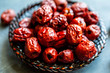 © Andrew Scrivani - Close up of dried red dates in bowl