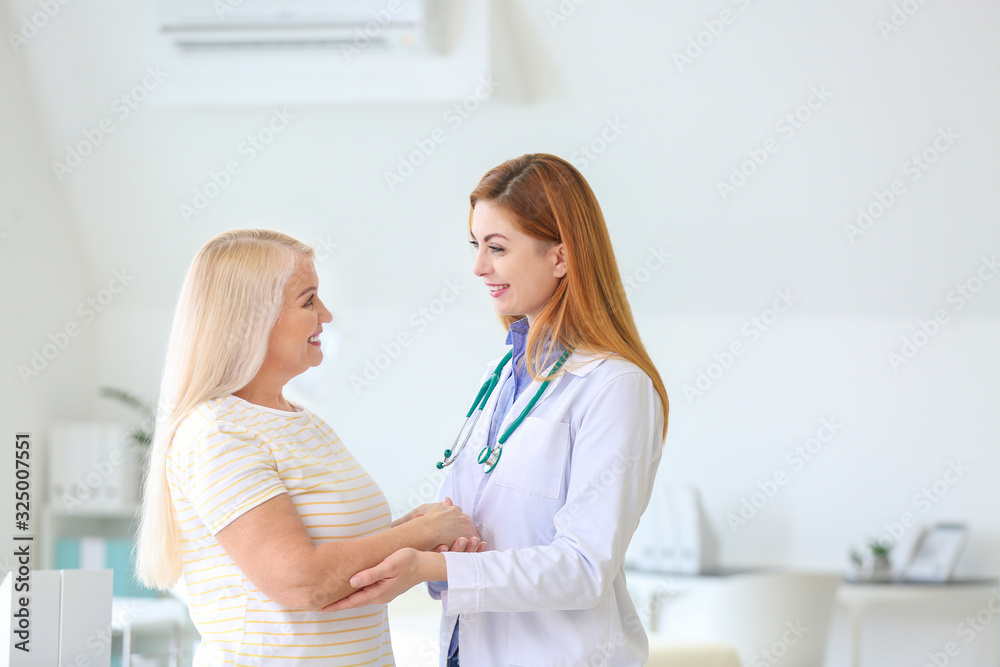 Mature woman visiting doctor in clinic