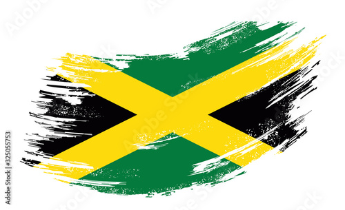 Photographie Jamaican flag grunge brush background. Vector illustration.
