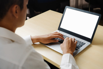 Wall Mural - Business person or office worker using laptop computer while sitting at desk.