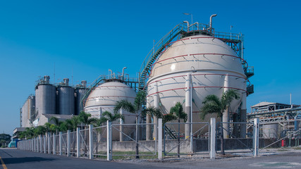 Gas storage sphere tank in oil and gas refinery plant or Petrochemical industry on blue sky background