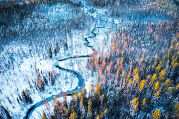 Aufkleber - River in winter forest at sunset time, aerial view