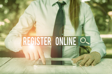 Leinwandbilder - Writing note showing Register Online. Business concept for System for subscribing or registering via the Internet Female business person sitting by table and holding mobile phone