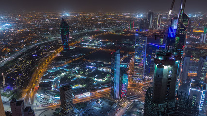  Skyline with Skyscrapers night timelapse in Kuwait City downtown illuminated at dusk. Kuwait City, Middle East