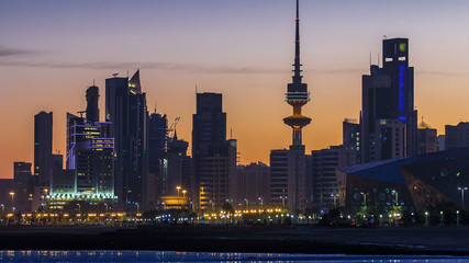 Seaside skyline of Kuwait city from night to day timelapse