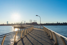 Empty Pier At Transmitter Park In Greenpoint Brooklyn New York Over The East River With A View Of The Manhattan Skyline Before Sunset