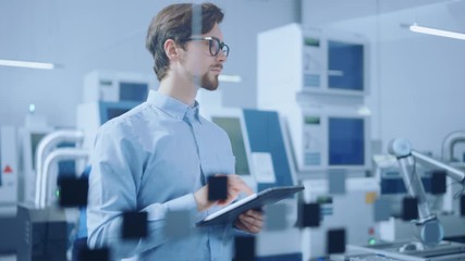 Poster - 
Modern Factory: Industrial Engineer Standing in Facility Workshop, Using Digital Computer, Inspecting and Monitoring Assembly Line Fucntioning. Functional Manufactory with CNC Machinery