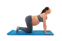 Pregnant Woman At Fitness Training Over White